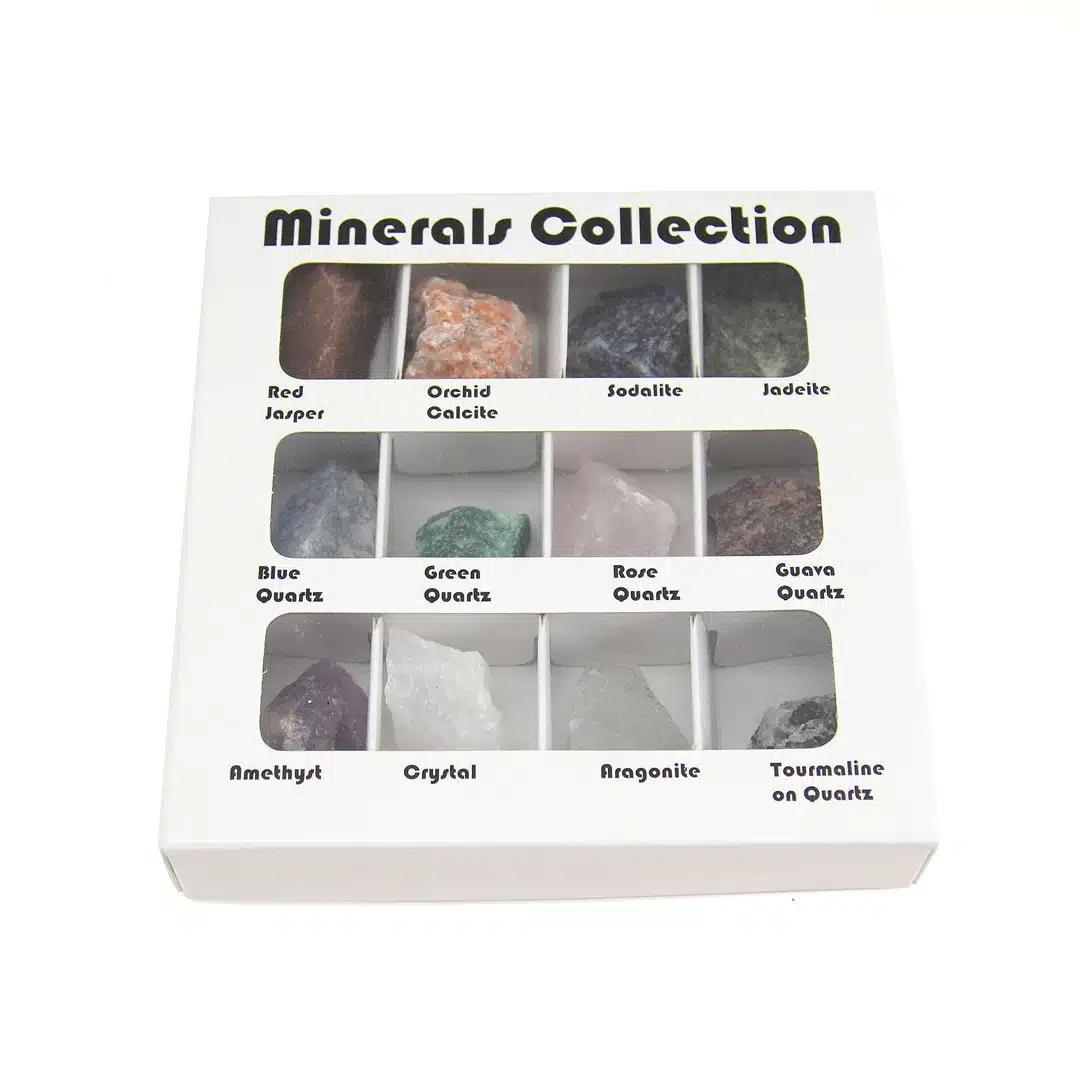 A box set containing 12 various polished minerals arranged in compartments, labeled with the mineral names.