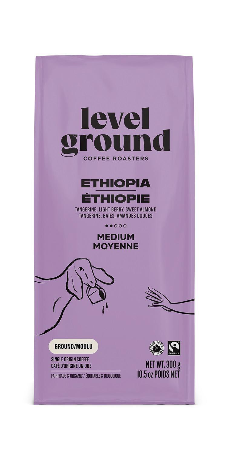 A bag of Level Ground Coffee Ethiopia with a purple and pink color scheme, featuring an illustration of a coffee plant and beans.