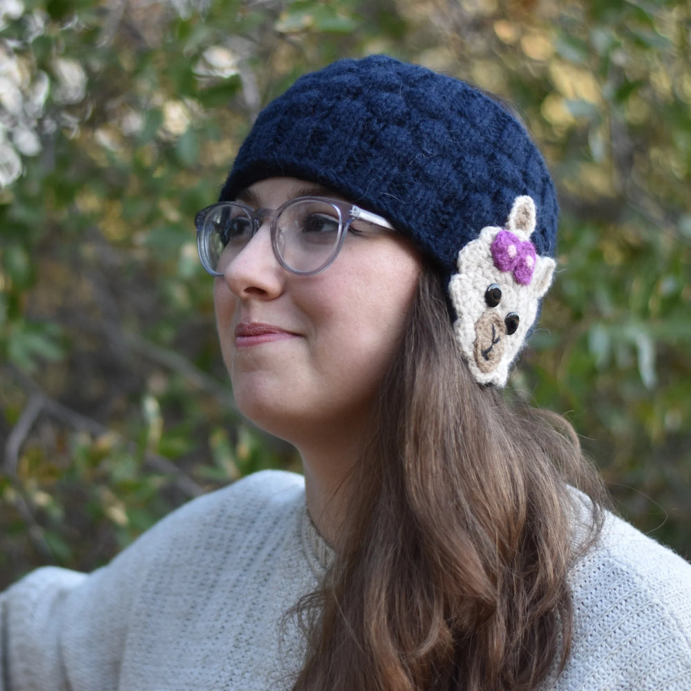 woman wearing a blue alpaca ear warmer