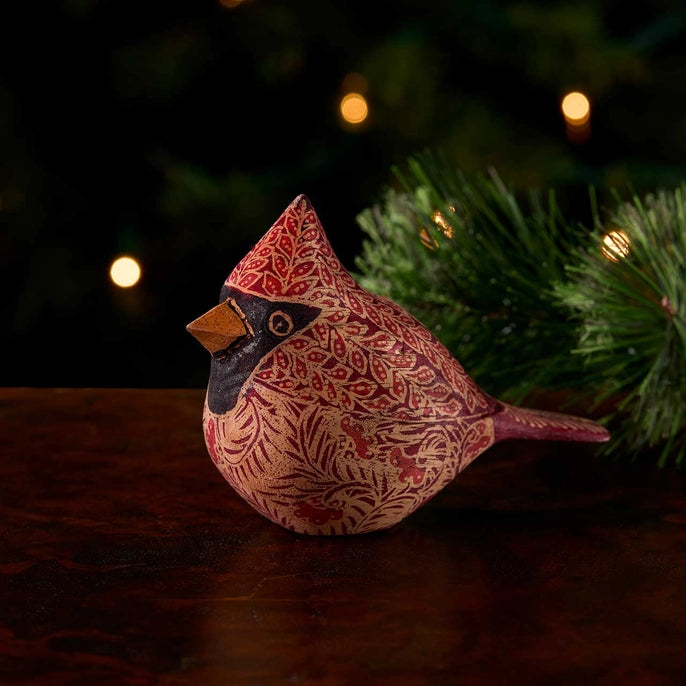 Decorative cardinal bird with intricate patterns on a dark background