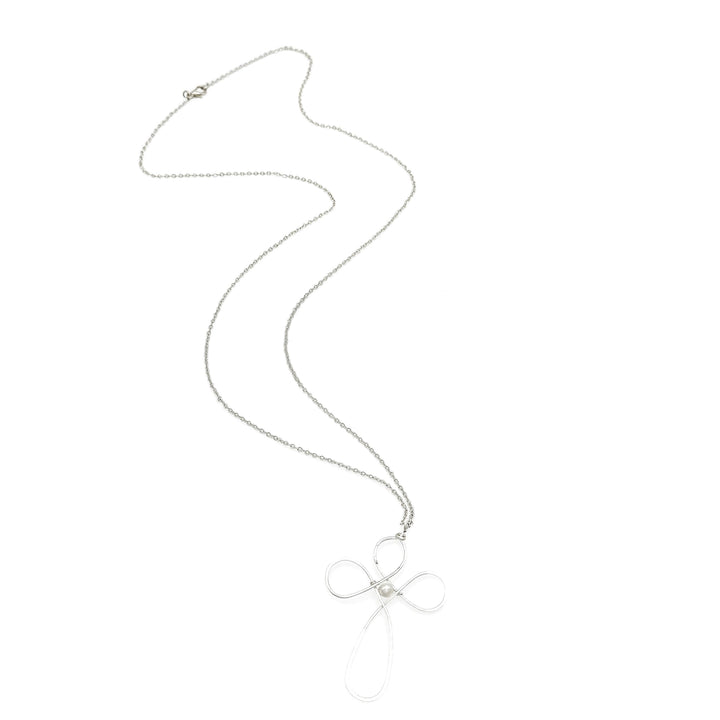 Silver necklace with a bow pendant on a white background