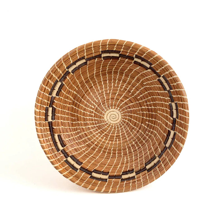 pine needle basket on a white background