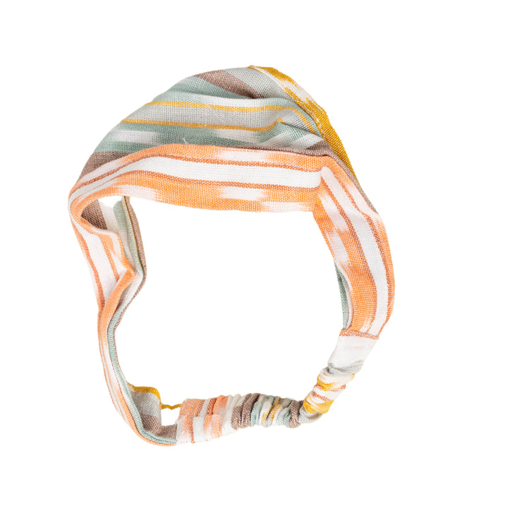 Striped headband with orange, white, and multicolor pattern on a white background
