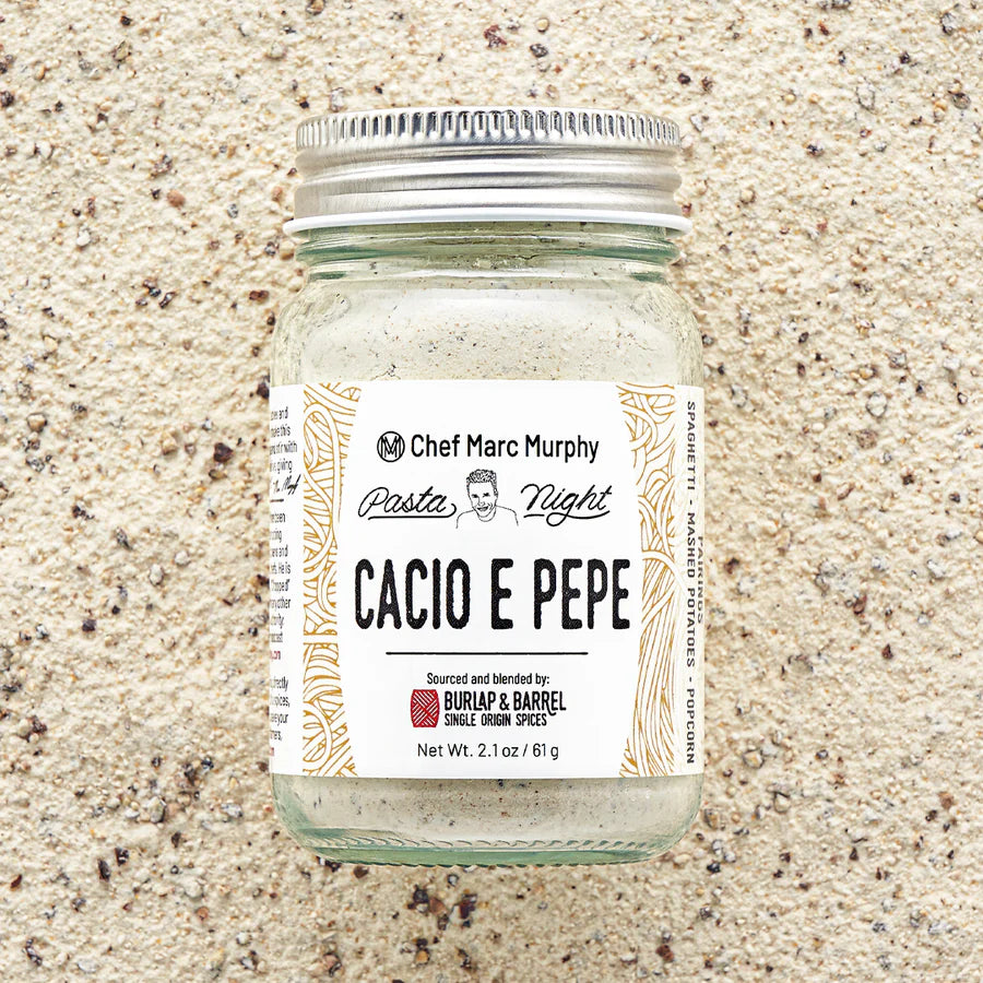 Jar of 'Cacio e Pepe' seasoning with a label on a textured beige background