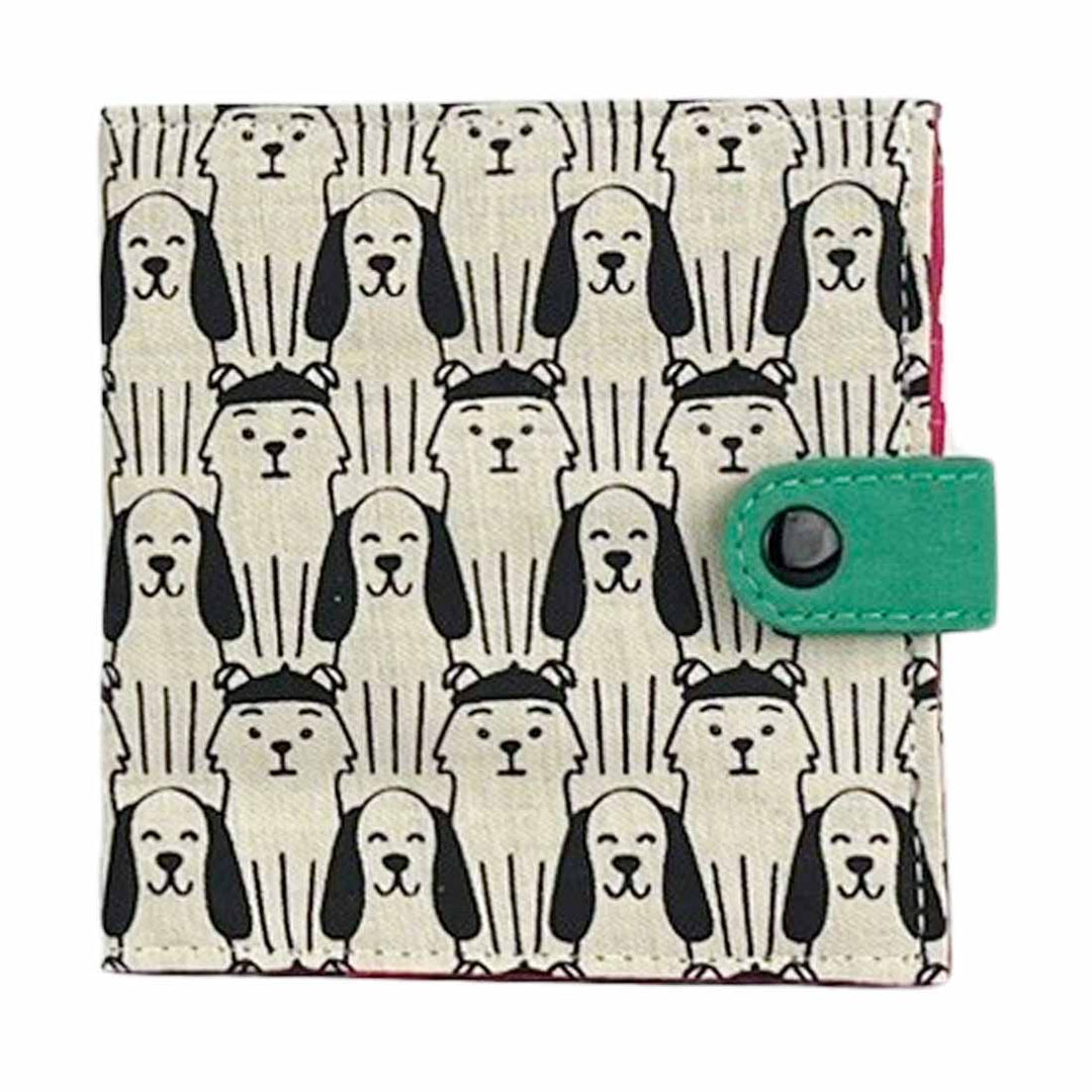Small pouch with dog pattern and green flap on a white background