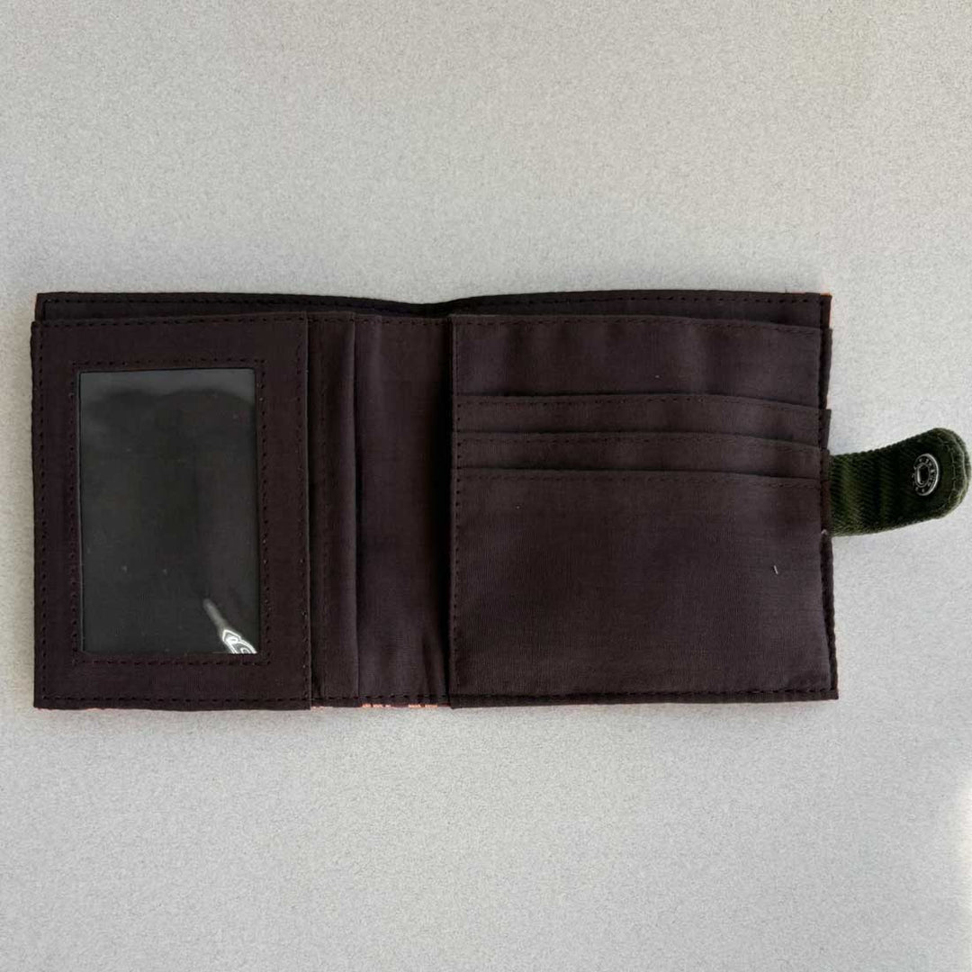Open black wallet on a light gray background