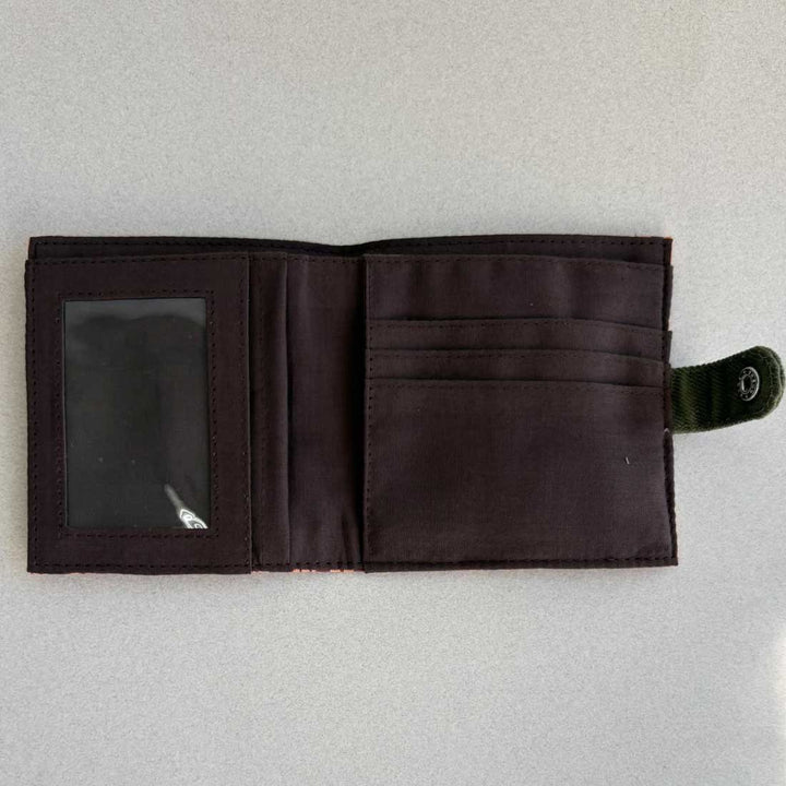 Open black wallet on a light gray background
