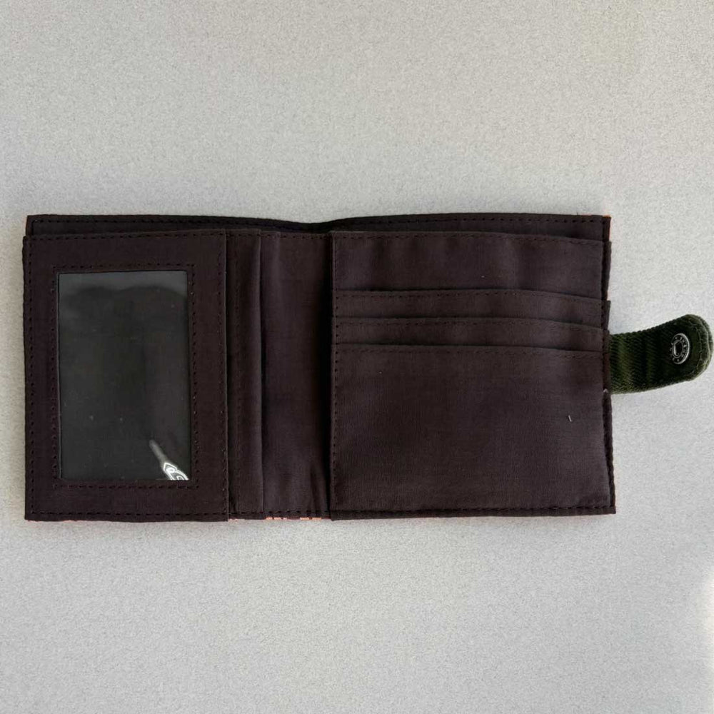 Open black wallet on a light gray background