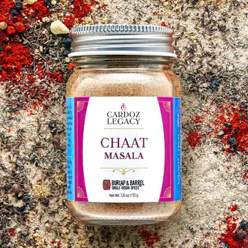 Chaat Masala jar with spices background