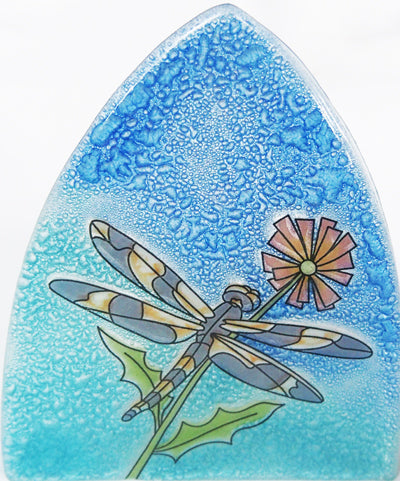 a glass nightlight with dragonfly and pink flower