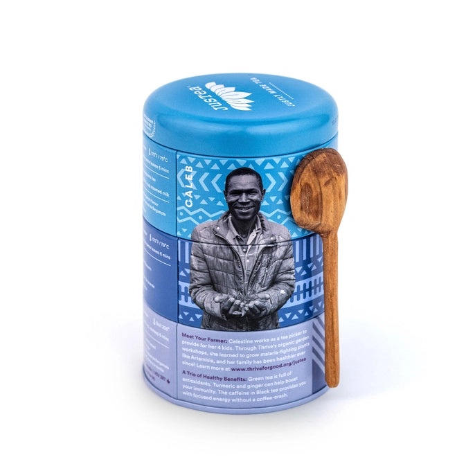 JusTea earl grey trio tin with wooden spoon on a white background