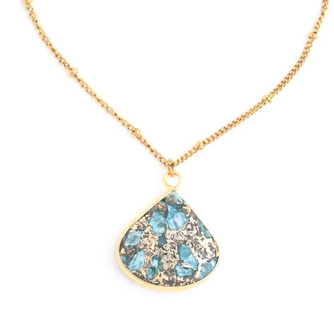 Necklace with a teardrop-shaped pendant featuring blue stones on a white background