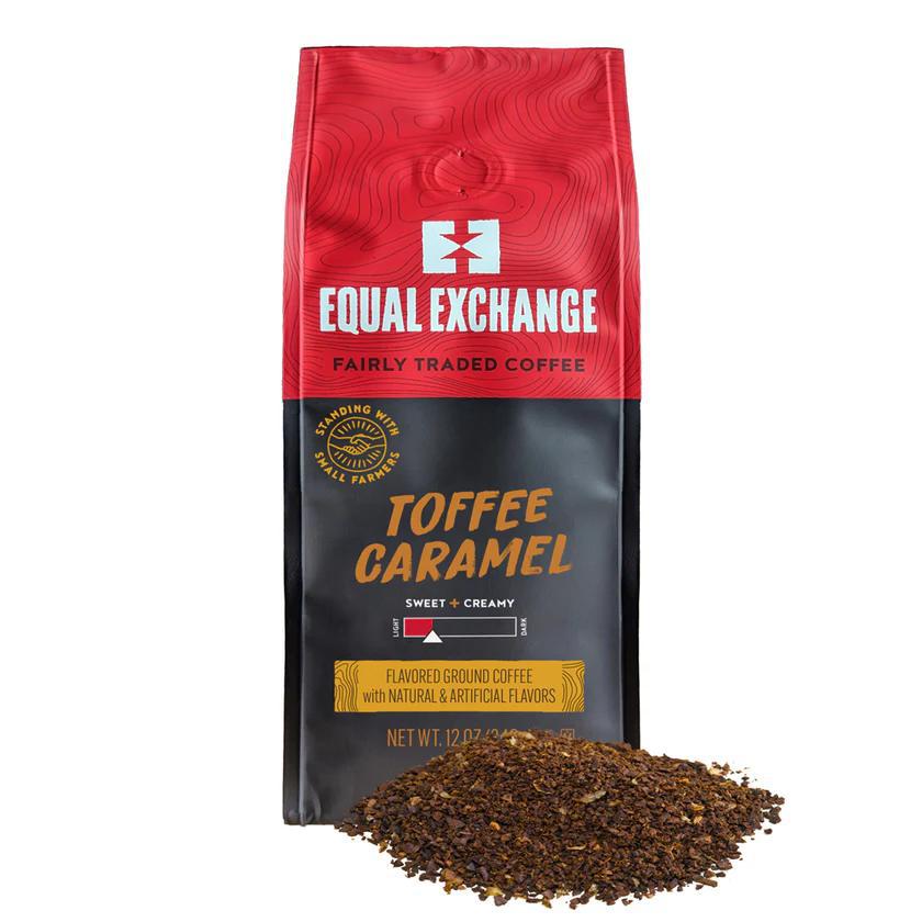 A bag of Equal Exchange fairly traded Toffee Caramel flavored coffee with a pile of ground coffee in the foreground.