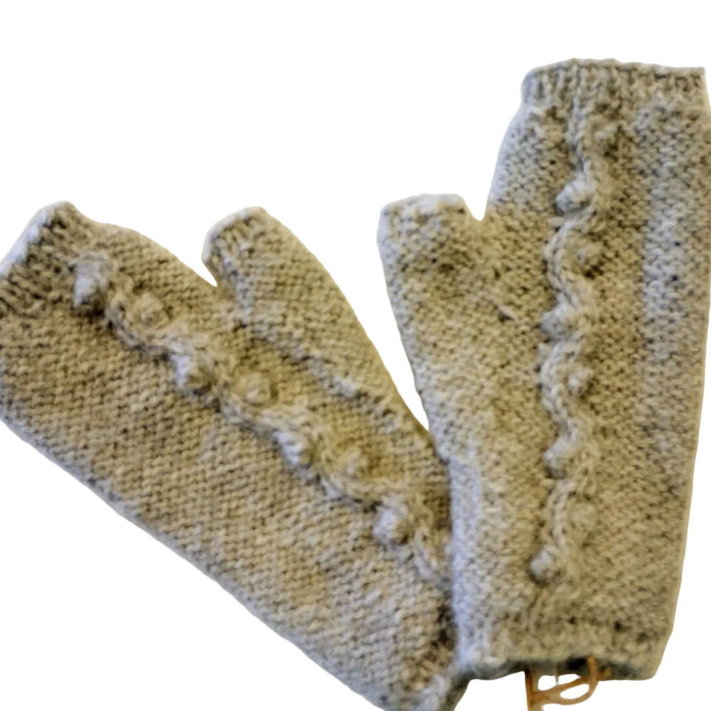 Pair of knitted fingerless gloves on a light background