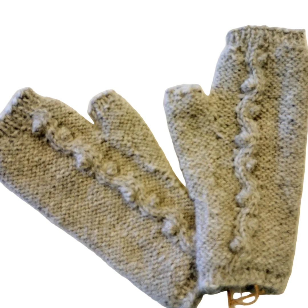 Pair of knitted fingerless gloves on a light background