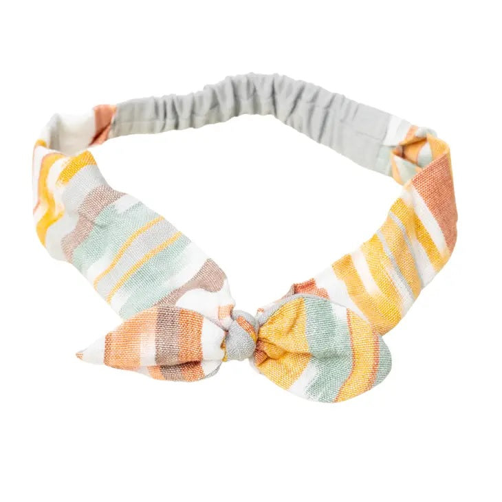 Striped headband with a bow on a white background