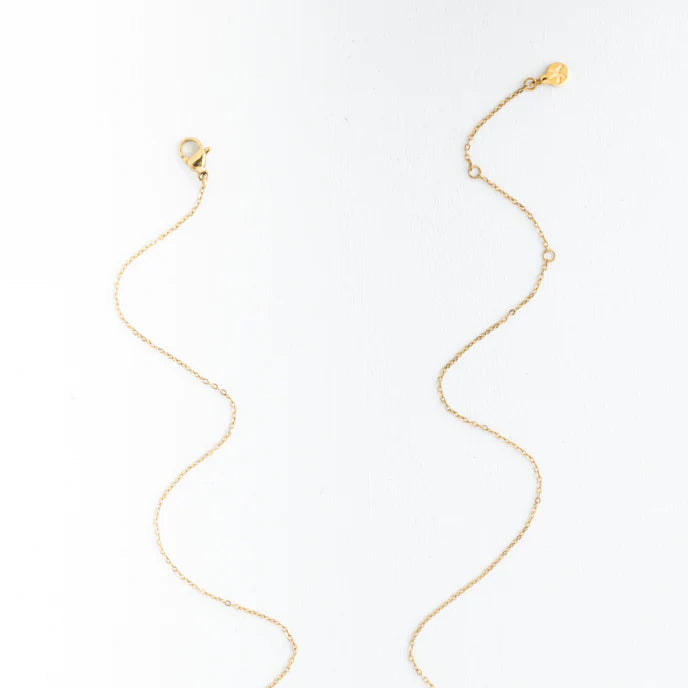 Gold necklace on a white background