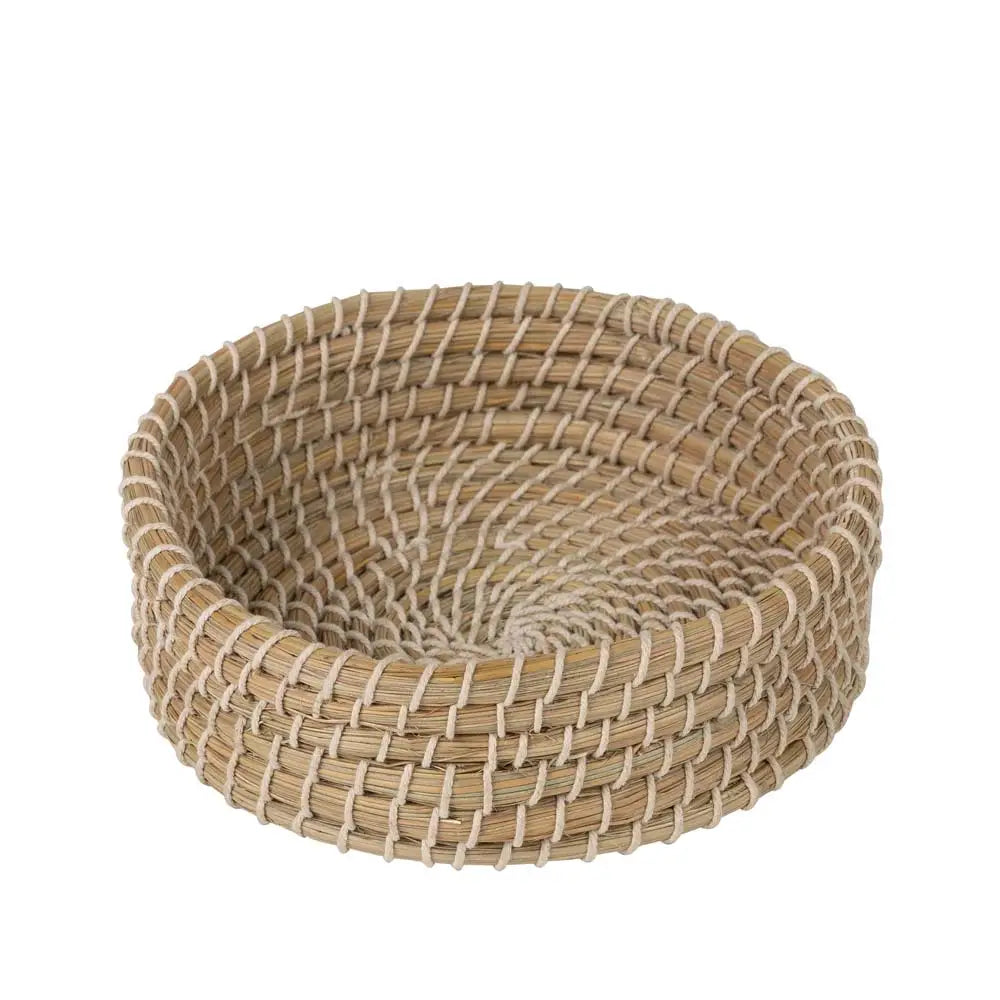 Woven basket made of natural materials on a white background