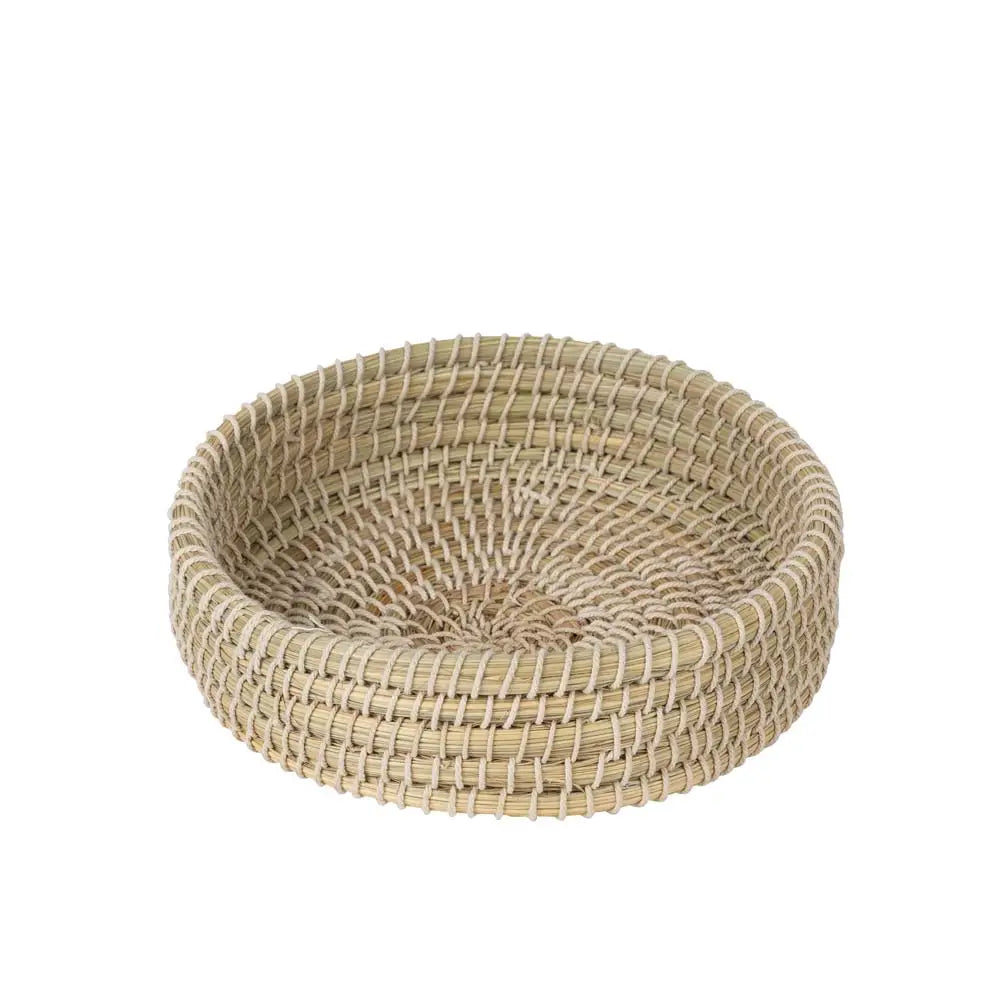 Woven basket made of natural materials on a white background