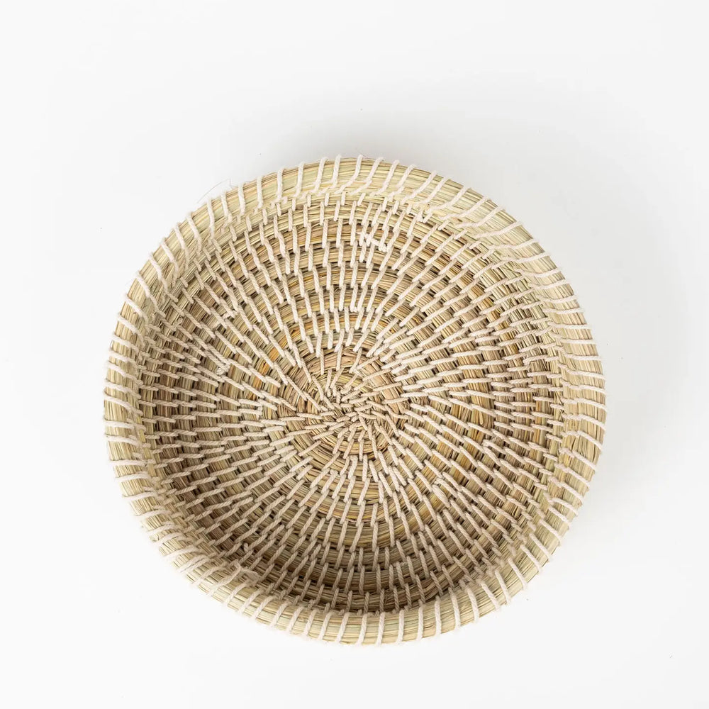 Woven rattan basket on a white background