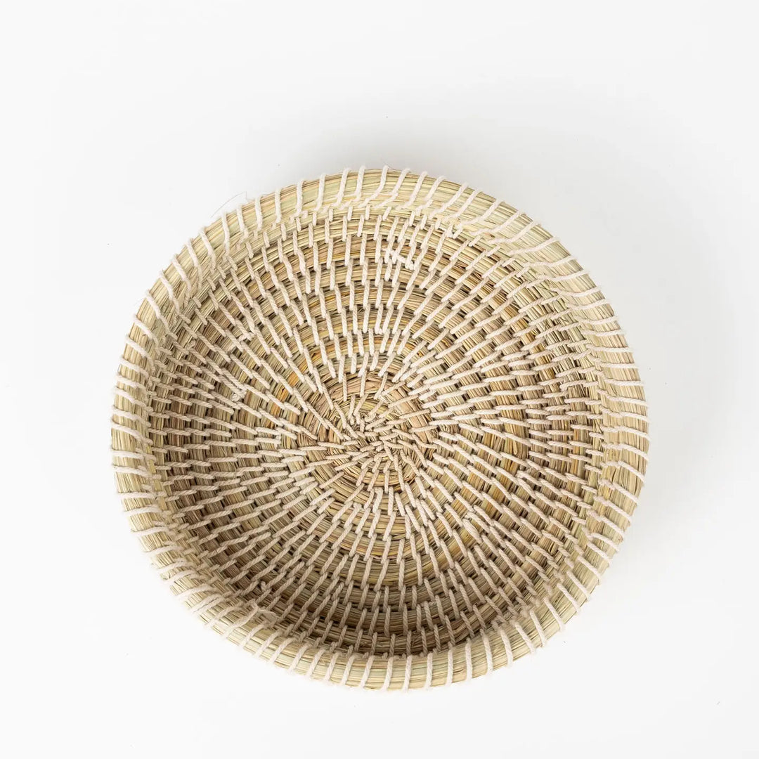 Woven rattan basket on a white background