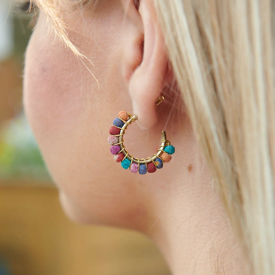 Close-up of Kantha multicolored gold-plated mini hoop earrings