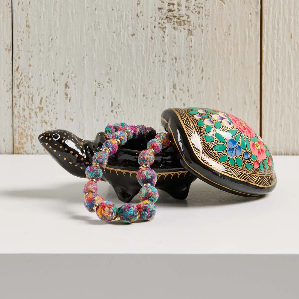 a kashmiri turtle box with a kantha necklace