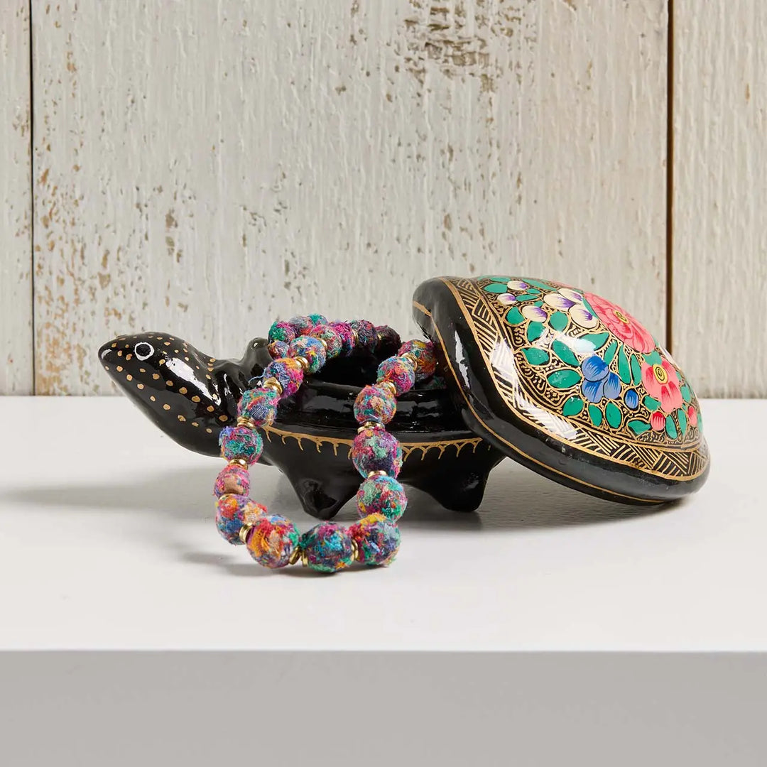 a kashmiri turtle box with a kantha necklace