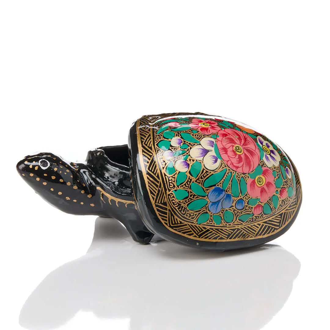 an open kashmiri turtle box on a white background