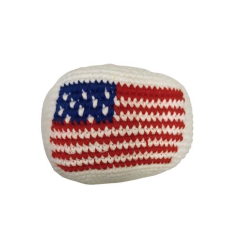 Handmade knitted hacky sack with American flag pattern on a white background