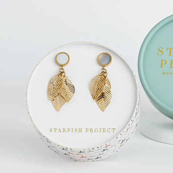 A leaf dangle earring with mother of pearl in a Starfish Project gift box. 
