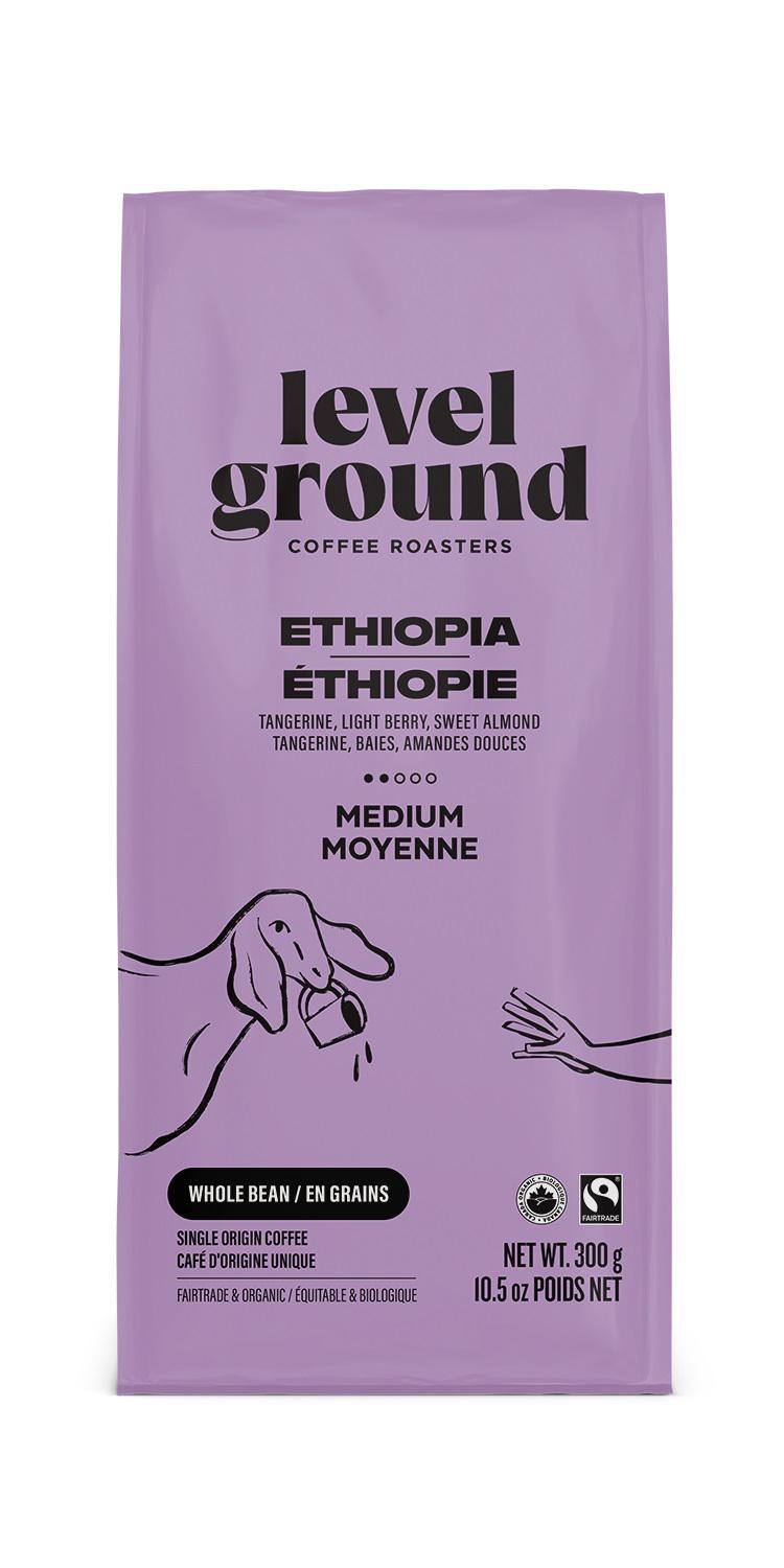 A bag of Level Ground Coffee Ethiopia with a purple and pink color scheme, featuring an illustration of a coffee plant and beans.