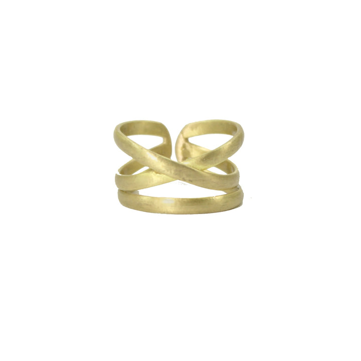 Gold ring with linear details on a white background.