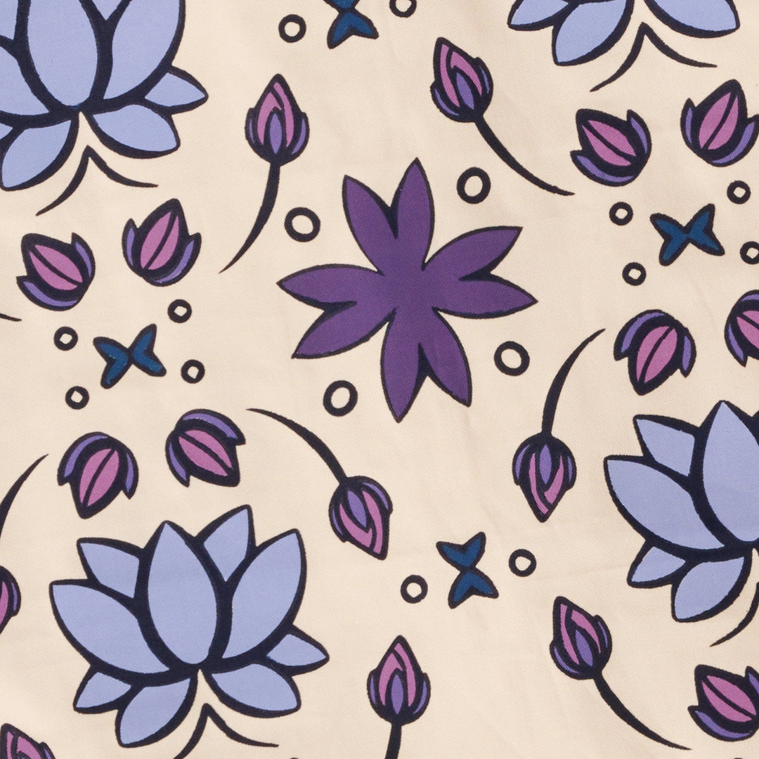 Pattern of purple and blue lotus flowers on a beige background