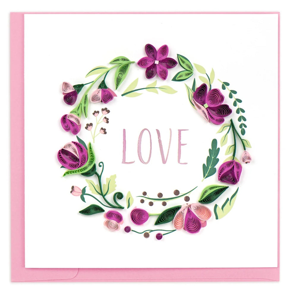 Card with floral wreath design and the word 'LOVE' in the center, on a white background.