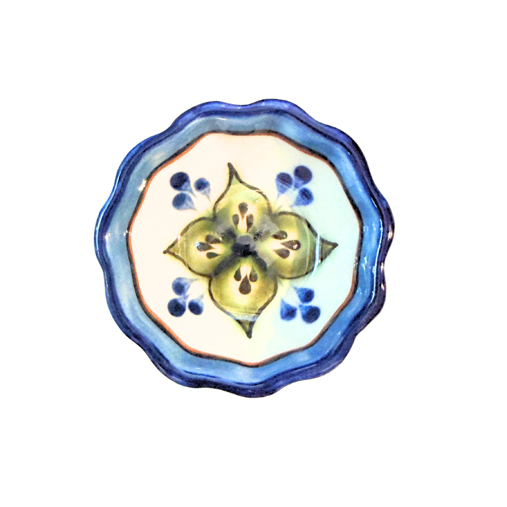 Ceramic bowl with decorative design on a white background