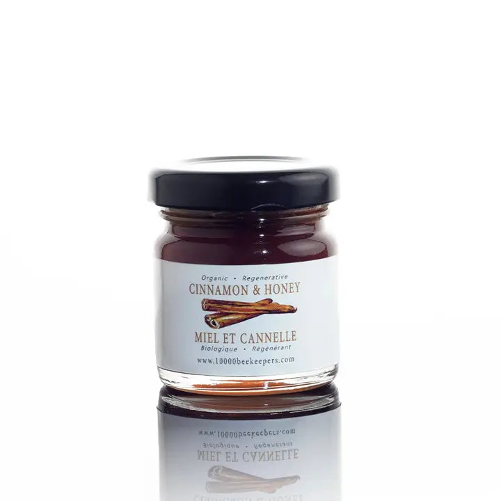 jar of cinnamon honey on a white background