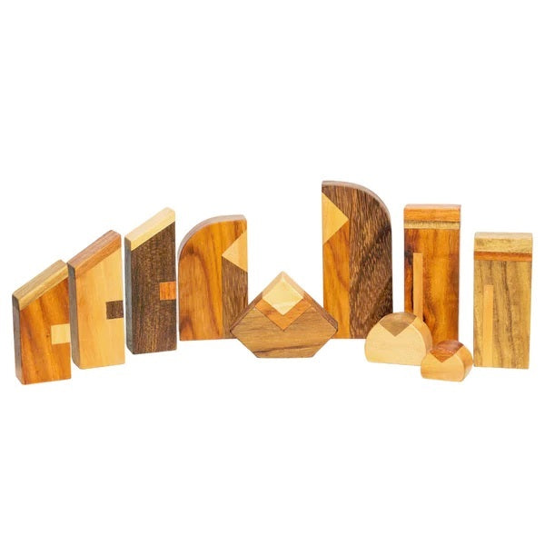 Set of wooden geometric nativity shapes on a white background