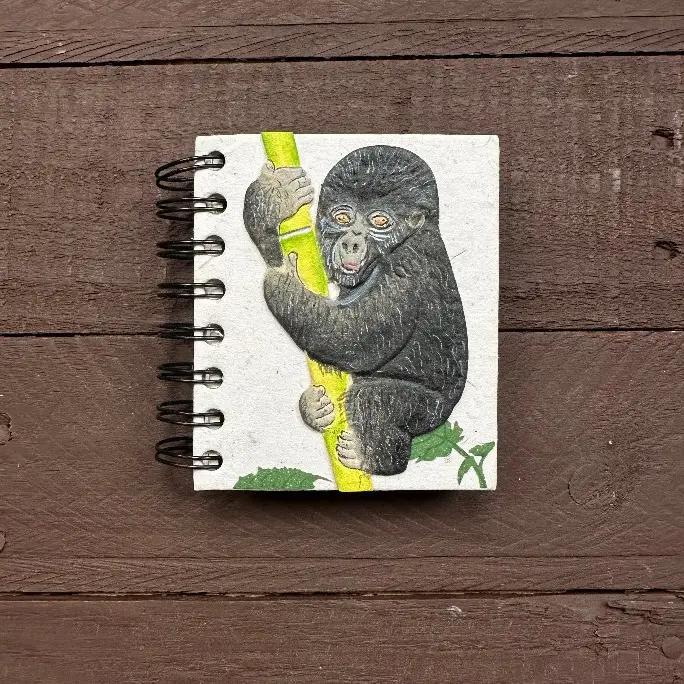 small spiral notebook with baby gorilla