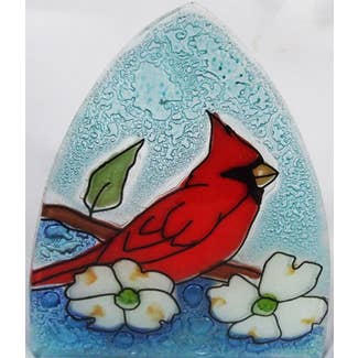 a glass nightlight with red cardinal and dogwood flowers