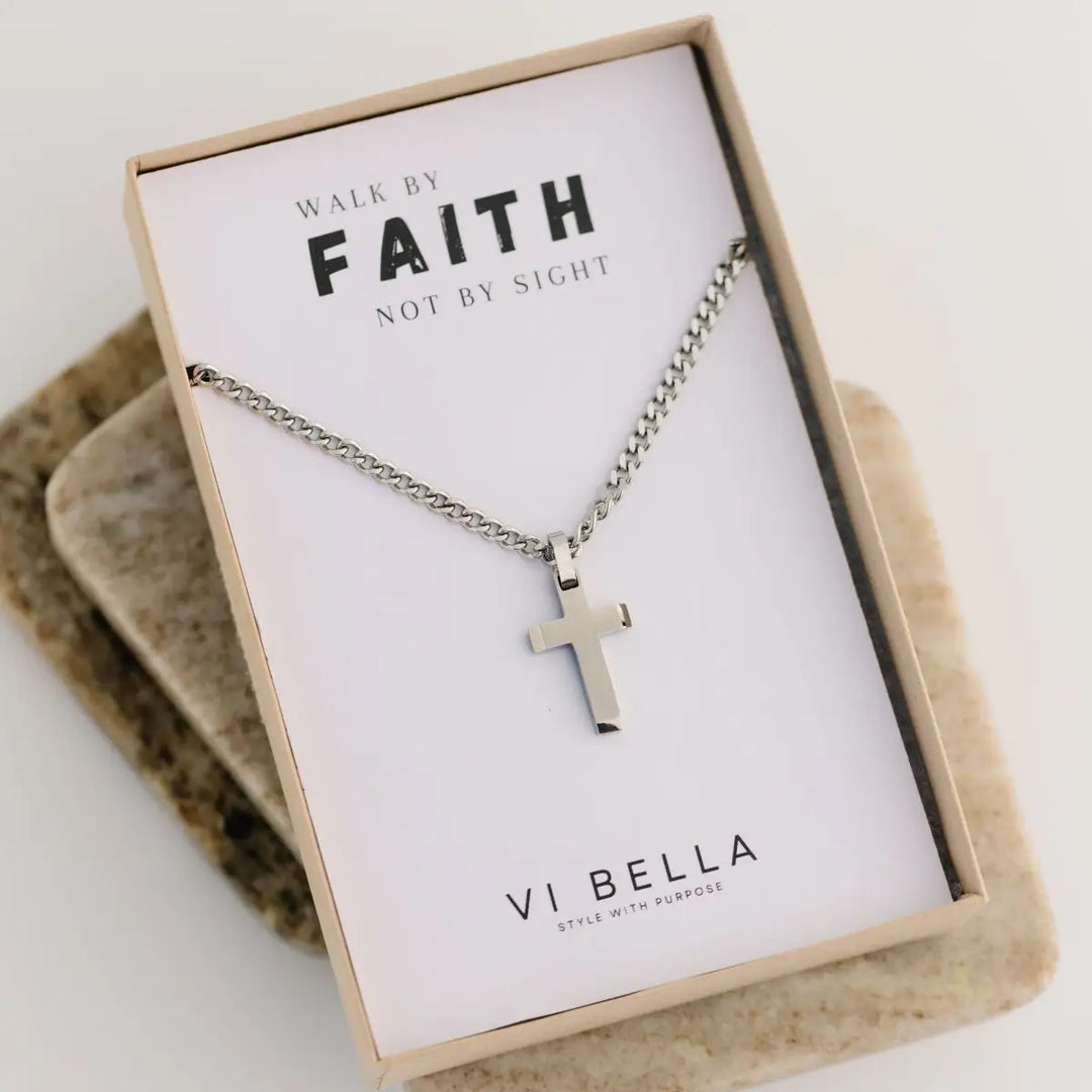 Silver cross necklace in the packaging