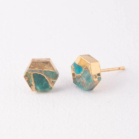 Hexagonal earrings with gold and teal finish on a white background