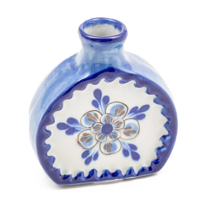 Ceramic vase with blue and white floral design on a white background