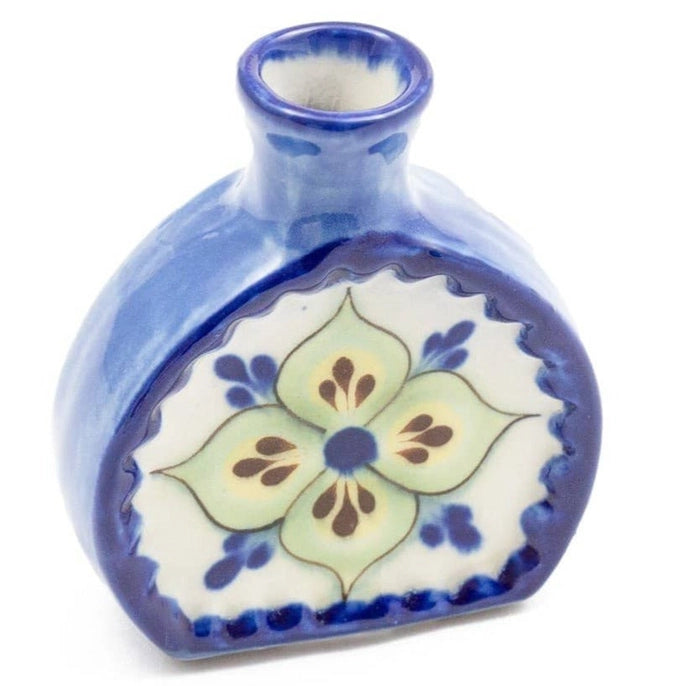 Ceramic vase with floral design on a white background