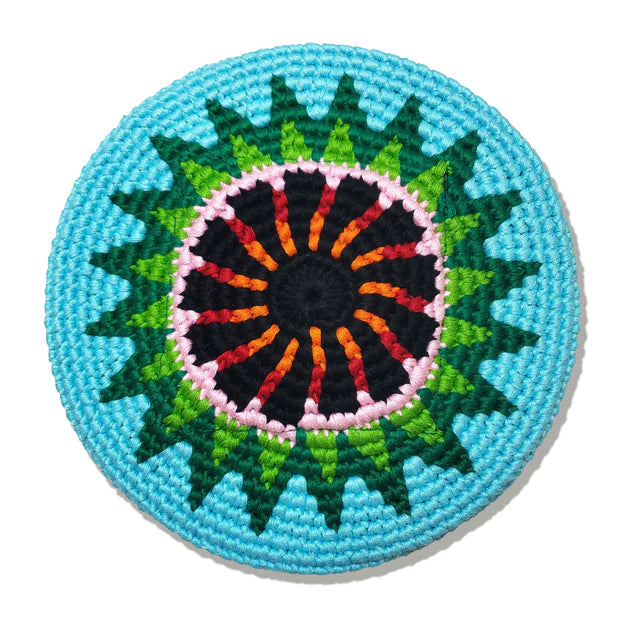 Round flying disk with colorful concentric pattern on a white background