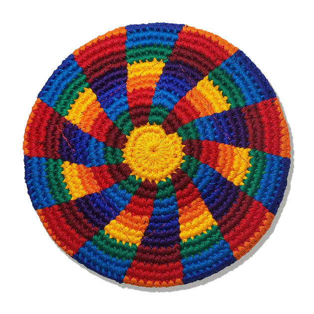 Colorful crocheted flying disk with a yellow center on a white background