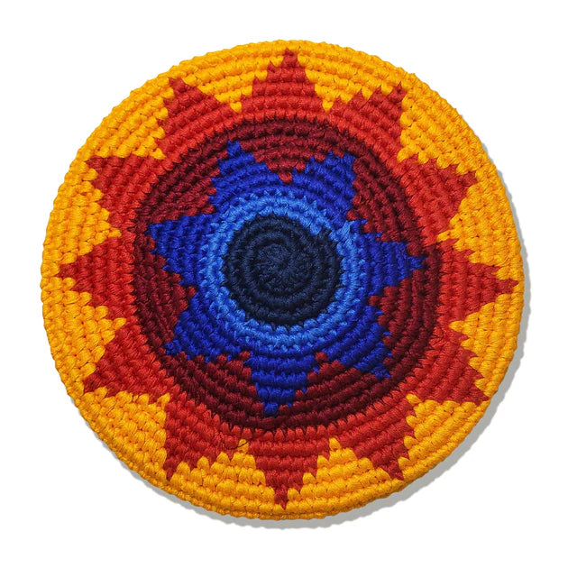 Colorful flying disk with concentric patterns on a white background