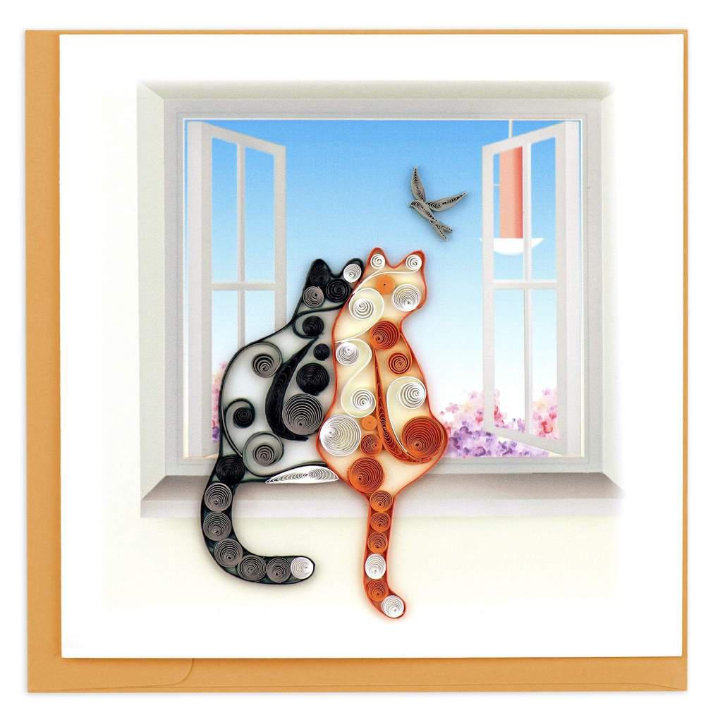 A quilled greeting card featuring an artistic depiction of two cats, with one cat facing away looking out of a window, and the other lying down. The card has a three-dimensional feel and includes a blank insert for a personal message.