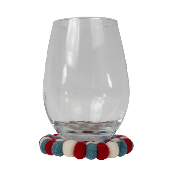 Clear glass with colorful bead holder on a white background