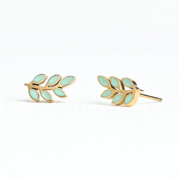 Gold leaf-shaped earrings with light green leaves on a white background